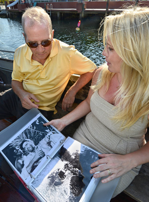 Image 2 - Stephen Bogart examines photographs of his father's illustrious movie career aboard the African Queen with Suzanne Holmquist, who helped refurbish the 100-year-old vessel with her husband, Captain Lance Holmquist.